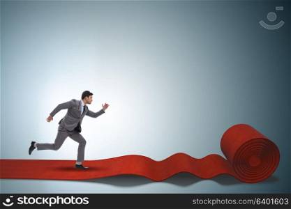 Businessman on the red carpet in success concept