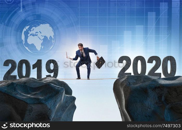 Businessman on the tight rope from year 2019 to 2020. Businessman on tight rope from year 2019 to 2020