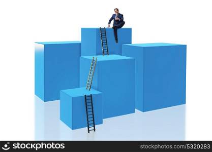 Businessman on top of block isolated on white