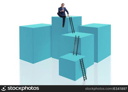 Businessman on top of block isolated on white