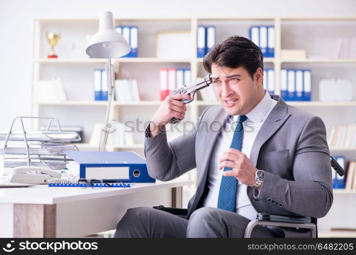 Businessman on wheelchair committing suicide. Disabled businessman on wheelchair in disability concept