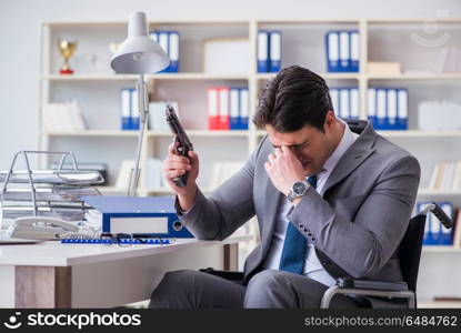 Businessman on wheelchair committing suicide. Disabled businessman on wheelchair in disability concept