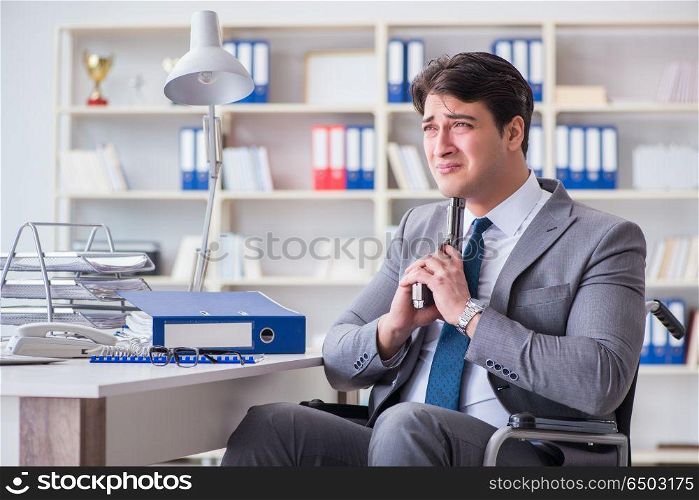 Businessman on wheelchair committing suicide. Disabled businessman on wheelchair in disability concept