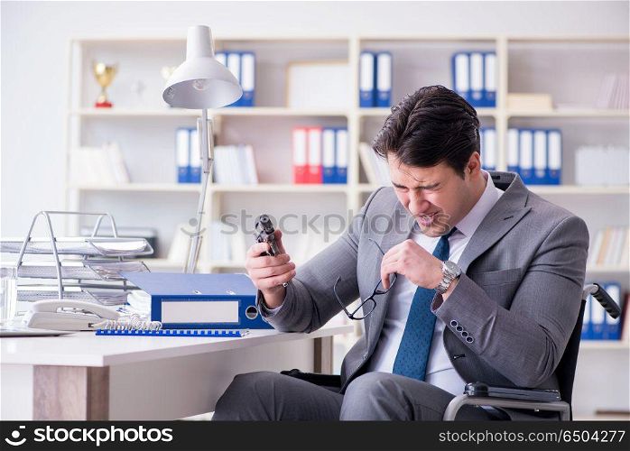 Businessman on wheelchair committing suicide. Disabled businessman on wheelchair in disability concept