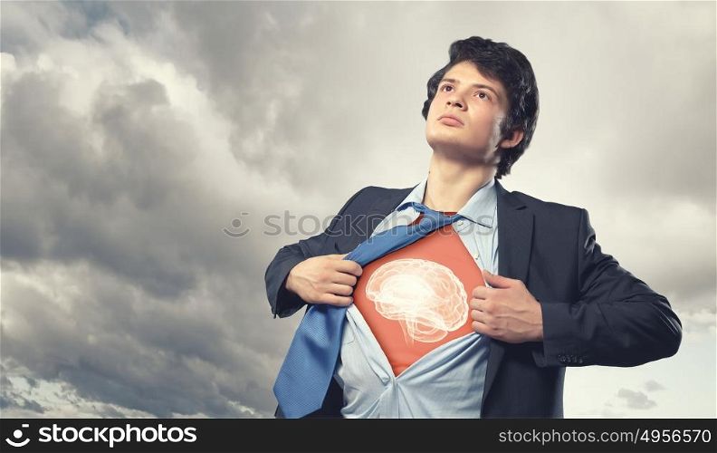 Businessman opening his shirt on chest acting like super hero. Super professional