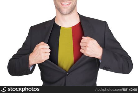 Businessman opening suit to reveal shirt with flag, Belgium