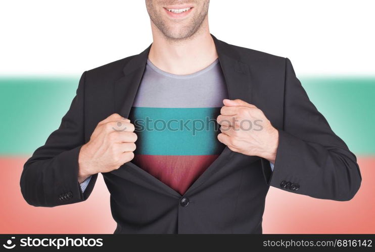 Businessman opening suit to reveal shirt with flag, Bulgaria