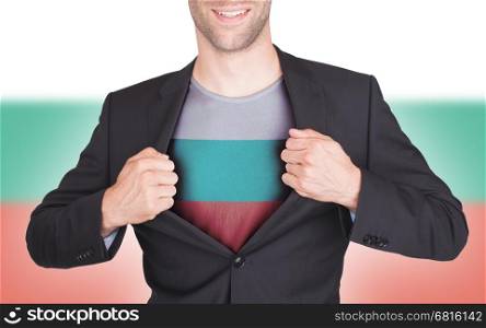 Businessman opening suit to reveal shirt with flag, Bulgaria