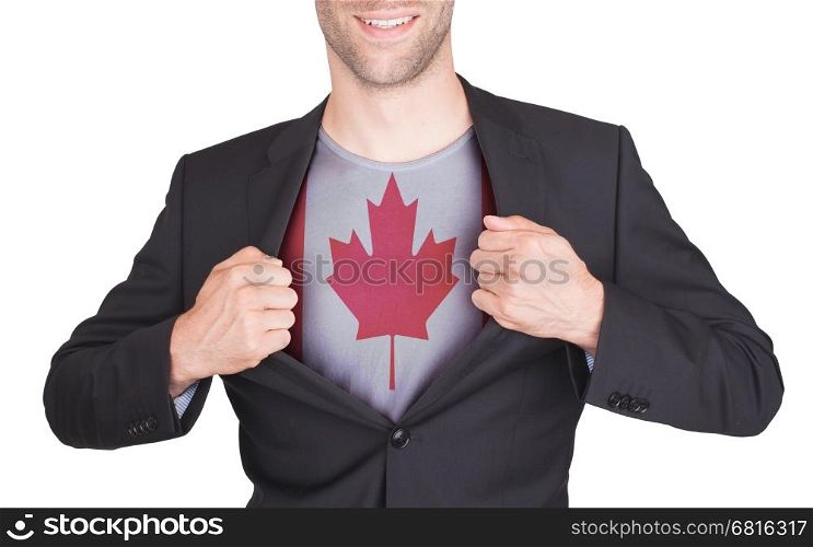 Businessman opening suit to reveal shirt with flag, Canada