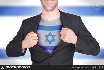 Businessman opening suit to reveal shirt with flag, Israel