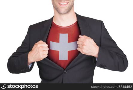 Businessman opening suit to reveal shirt with flag, Switzerland