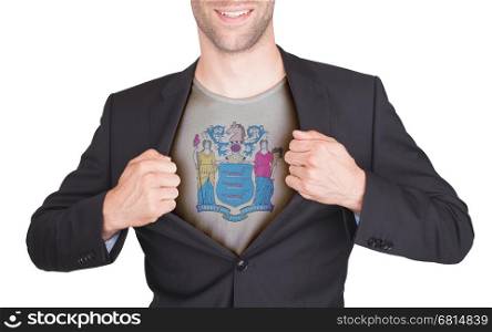 Businessman opening suit to reveal shirt with state flag (USA), New Jersey