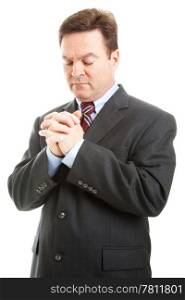 Businessman or minister with hands folded in prayer. Isolated on white.