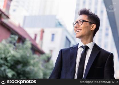 Businessman outdoors in city business district. Another good day ahead