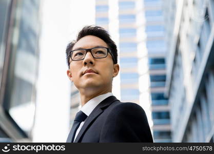 Businessman outdoors in city business district. I am professional and know it