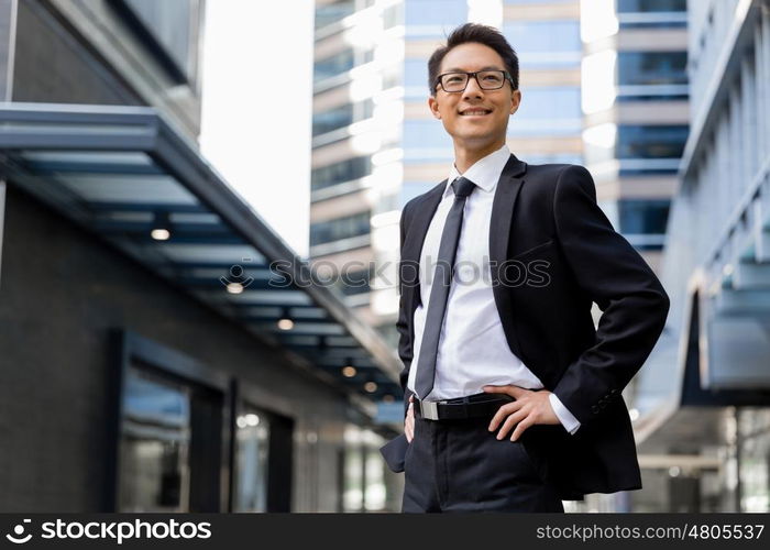 Businessman outdoors in city business district. I am professional and know it