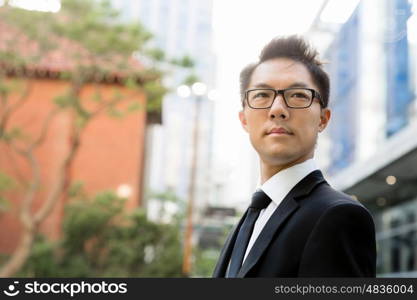 Businessman outdoors in city business district. I am professional and know it