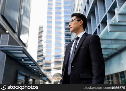 Businessman outdoors in city business district. I am professional and know it