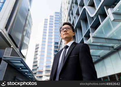 Businessman outdoors in city business district. I am professional and know it