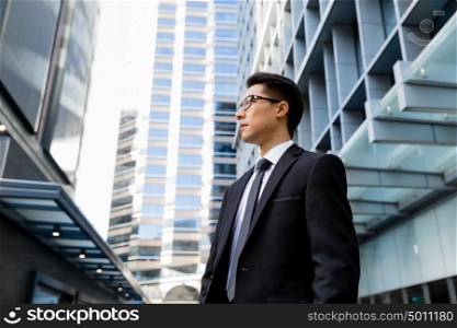 Businessman outdoors in city business district. I am professional and know it