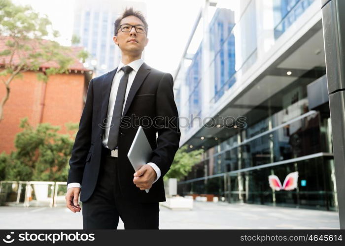 Businessman outdoors in city business district. On my way to success