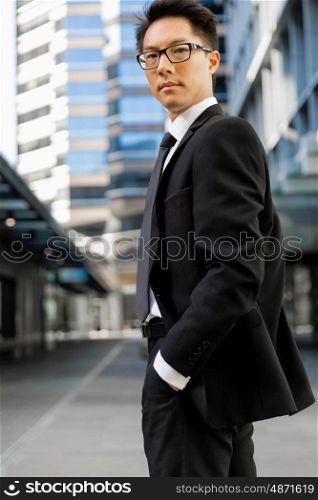 Businessman outdoors in city business district. Serious about my business