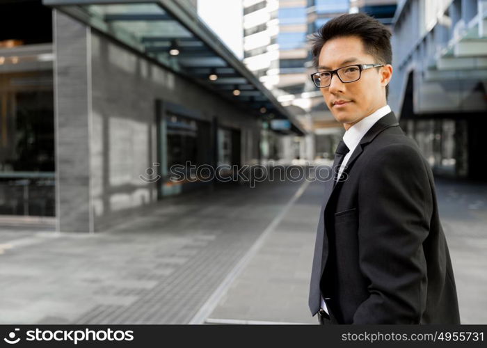Businessman outdoors in city business district. Serious about my business