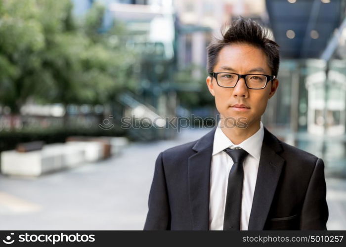 Businessman outdoors in city business district. Serious about my business