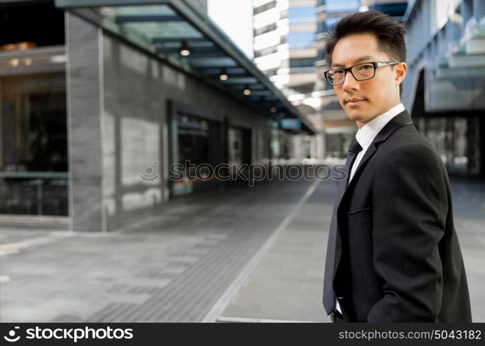 Businessman outdoors in city business district. Serious about my business