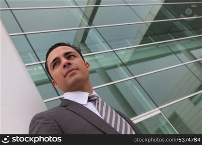 Businessman outside an office building