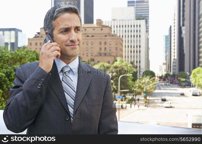 Businessman Outside Office On Mobile Phone