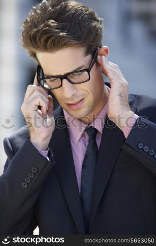 Businessman Outside Office On Mobile Phone