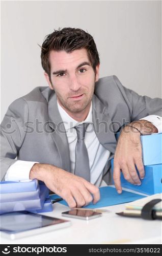 Businessman overwhelmed with work
