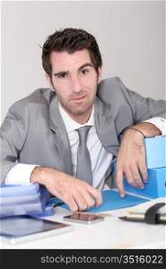 Businessman overwhelmed with work
