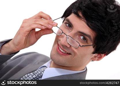 Businessman peering over his glasses