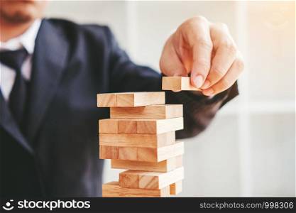 Businessman plan and strategy in business Domino Effect Problem solution