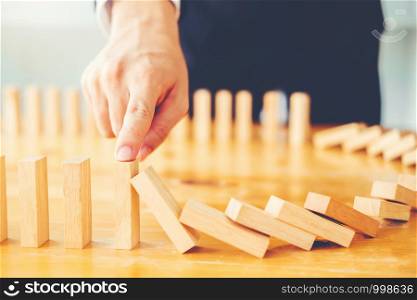 Businessman plan and strategy in business Domino Effect Problem Solving