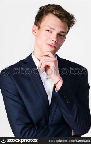 Businessman planning business strategy, against gray background. Businessman is thinking