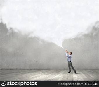 Businessman play pipe. Young businessman playing pipe and cloud coming out