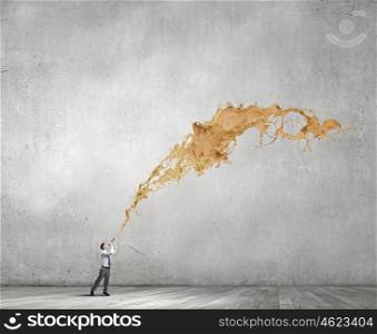 Businessman play pipe. Young businessman playing pipe and colorful splashes coming out