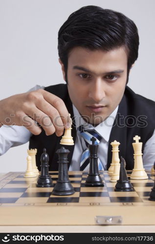 Businessman playing chess