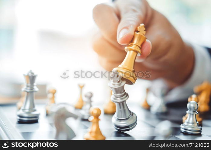 Businessman playing chess game Planning of leading strategy successful business leader concept