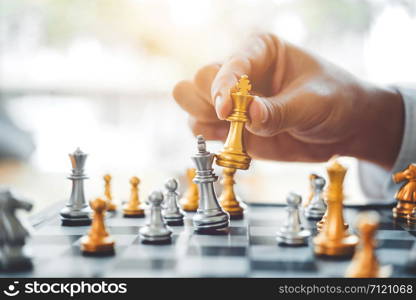 Businessman playing chess game Planning of leading strategy successful business leader concept