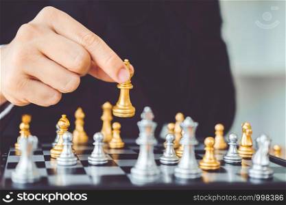 Businessman playing chess game Planning of leading strategy successful business leader concept