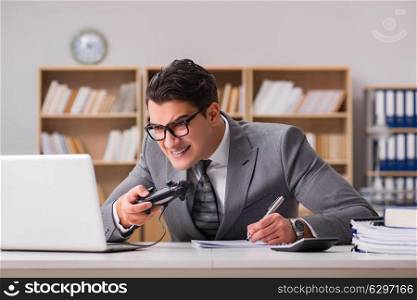 Businessman playing computer games at work office