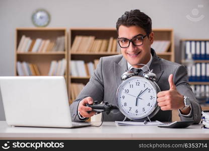 Businessman playing computer games at work office