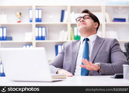 Businessman playing drums in office