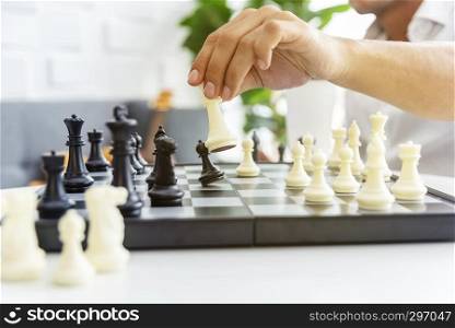 Businessman playing the chess game. Business strategy and tactic planing. Competition and winer concept.