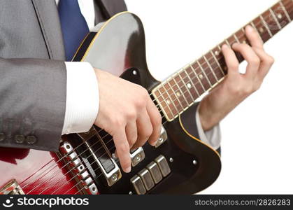 Businessman playing the guitar on white