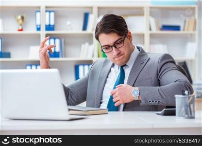 Businessman playing virtual guitar in office